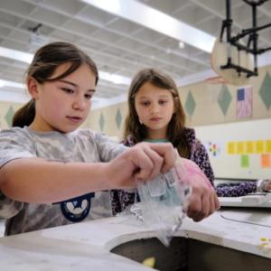 kids working on composting