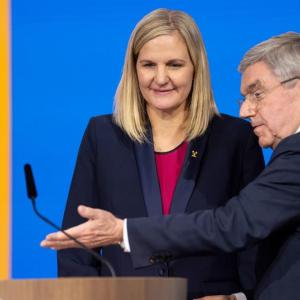 Kirsty Coventry being welcomed up to a lectern 