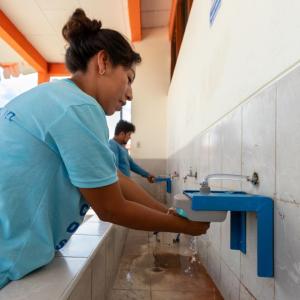 people washing their hands