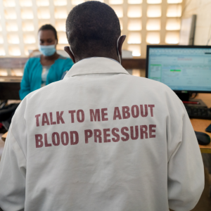 Person with a shirt that reads "Talk to me about blood pressure" 