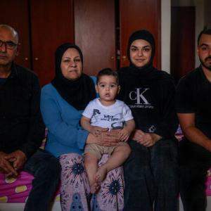 Mahmoud and his family in their room at the Montana Collective Shelter.
