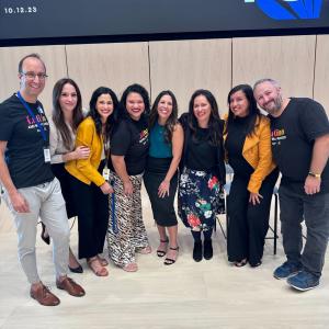 A small group posed together, smiling.