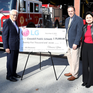 (l-r) U.S. Rep. Bill Pascrell, Jr. (N.J.-09), Cresskill Schools Superintendent Michael Burke, and LG Electronics USA SVP Peggy Ang stand together as LG presents Cresskill Schools with $25,000 in support in additional to new equipment to educate students.
