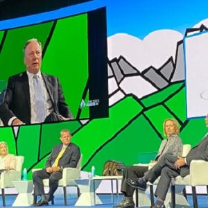 People sat on stage at the LNG2023 conference