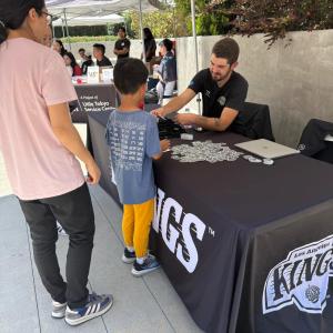 Members from the Little Tokyo Service Center stop by at the LA Kings booth at pLAy Day