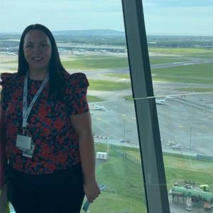 Leanne McGarry stood in front of an airport window 