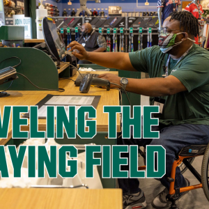 person in wheelchair on computer