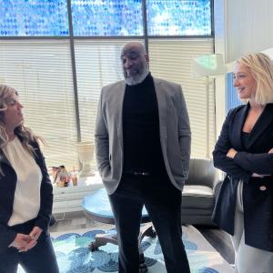 Representatives from KeyBank shown speaking with Liberty Community Services team members.