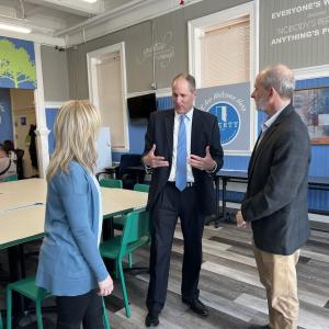 KeyBank representatives speaking in the offices of Liberty Community Services.