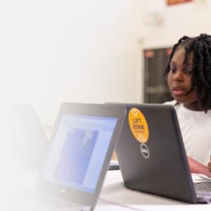 Two children at laptops