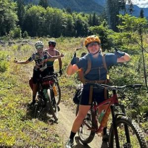 Lindsey Henry cycling on a trail. 