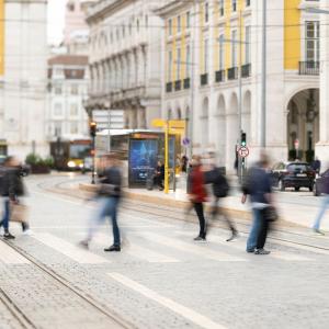 People walking across a street