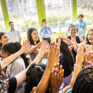 Live Más Scholarship recipients high fiving