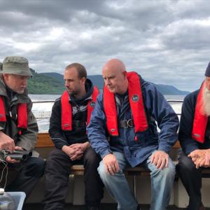 Eric Verspoor, Gert-Jan Jeunen, Neil Gemmell, and Adrian Shine aboard the boat Deepscan on Loch Ness. | Photo by Neil Gemmell