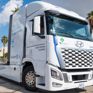 A white ZEV prototype sits in the parking lot.