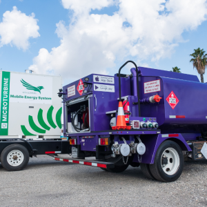 A Booster tanker sits next to a mobile energy solution.