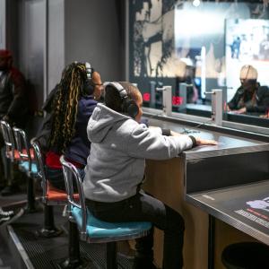 2 kids at listening stations