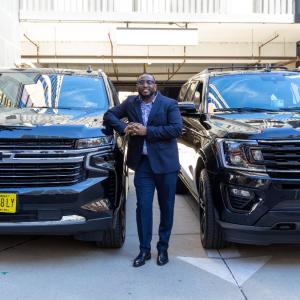 Person stood near two cars 