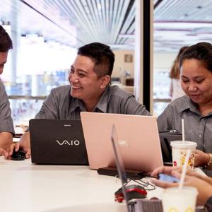 Group of staff around a table. 