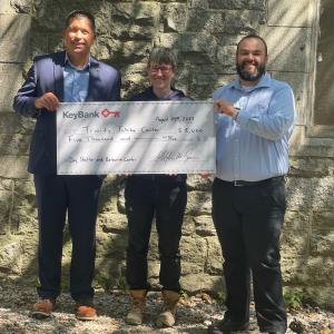 KeyBank and Maine Trinity Jubilee Center leaders shown with grant check.