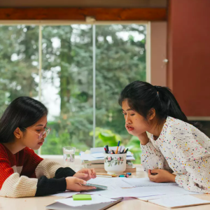 two girls studying