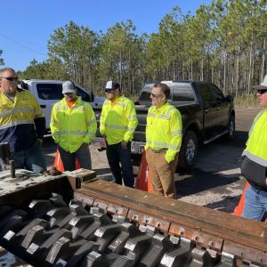 Crew standing outside Mission Mine
