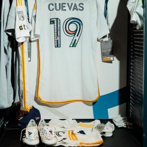 LA Galaxy's Mauricio Cuevas's decorated jersey and cleats in the locker room.