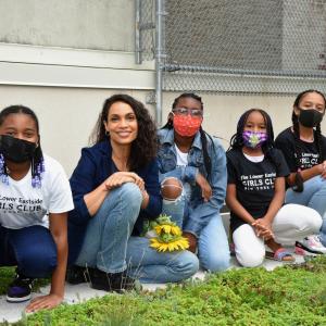 Actress Rosario Dawson poses with kids