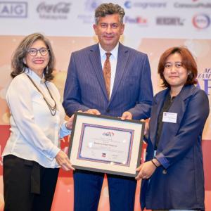3 People holding a framed certificate 