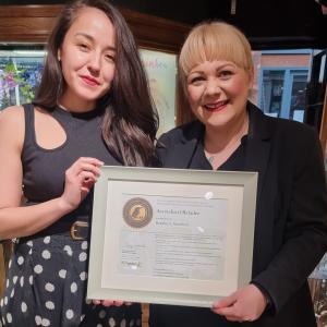 Maiko Eaton, UK Sales Manager at Green Rocks Diamonds and Kay Bradley, Owner of Bradley's Jewellers York and Eco Rocks holding her Accredited Retailer certificate from SCS Global