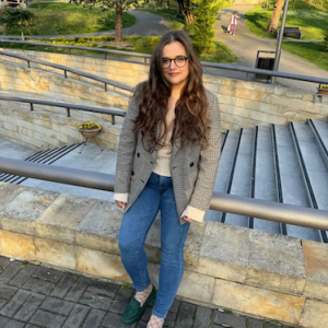 Maja seated on a stairway.