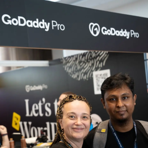 Maja shown at a GoDaddy Pro booth.