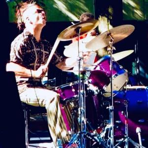 HARMAN employee playing the drums.