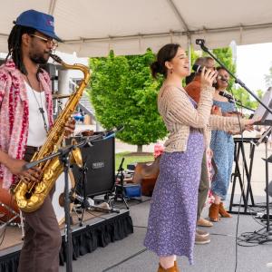 HARMAN employees onstage performing.