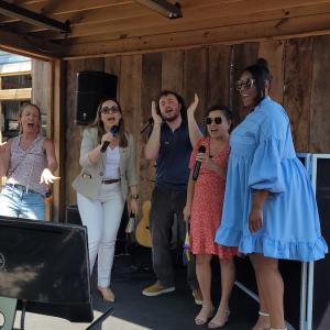 HARMAN vocal group on stage.