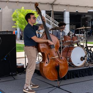 HARMAN musician playing an upright bass.