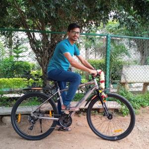 Mallikarjun Kanoj on a bicycle