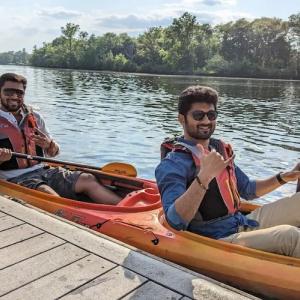 Manoj in a canoe with a friend.