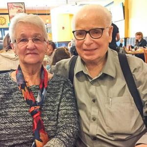 Marie and Germain Routhier seated in a restaurant.
