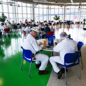 people sitting in a cafeteria 