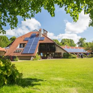 Martin House with grass in front on sunny day