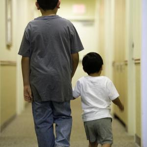 Big brother and little brother walking 