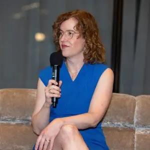 Mary Jacques speaking with a microphone.