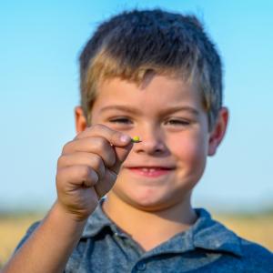 child holding a seed