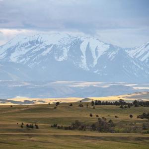 View of a mountain range in the background with grasslands in the foreground. © WWF-US/Clay Bolt