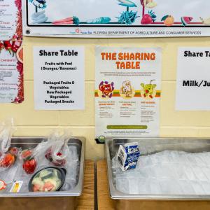 Trays with ice on a table labeled "Share Table." © WWF-US/Rebecca Drobis