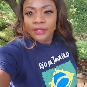 Selfie of Olivia in front of a beautiful tree.