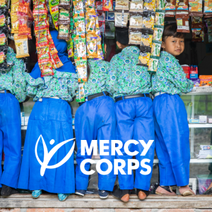 group of children with the Mercy Corps logo superimposed