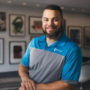 Photo of Micha Greene shown wearing a Principal Financial Group polo.