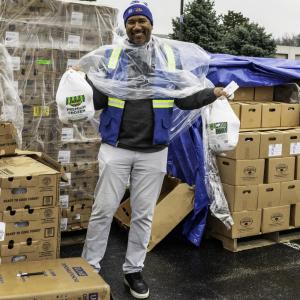 Volunteer holding turkeys